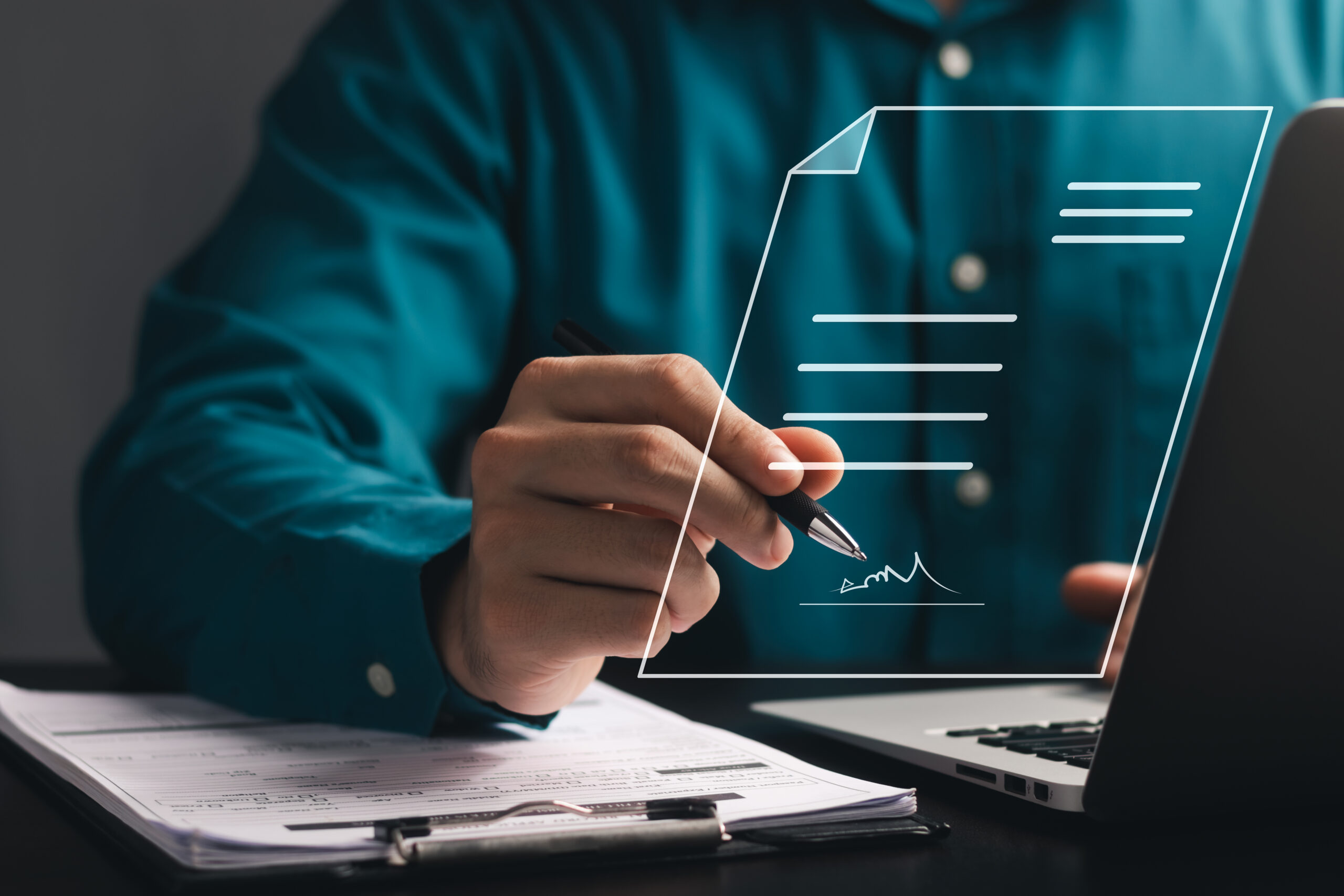 electronic signature concept, electronic signing businessman signs electronic documents on digital documents on virtual laptop screen.