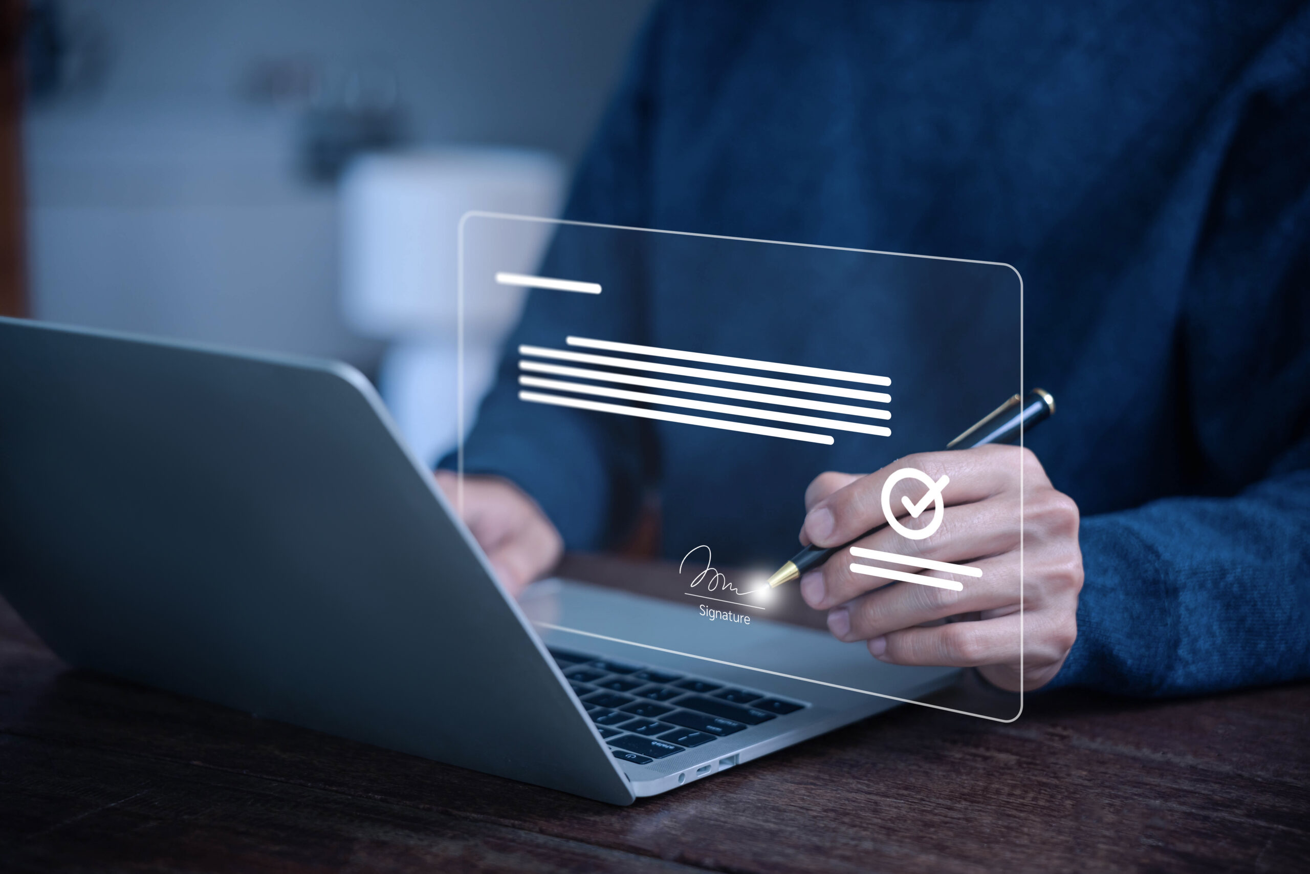 man signing a digital document on a laptop using electronic signature technology, representing online contract approval, secure e sign, paperless business agreement concepts. smart contract signature